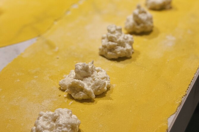 Authentic Roman Pasta & Tiramisu Experience with Italian Wine - Rolling pasta dough the traditional way
