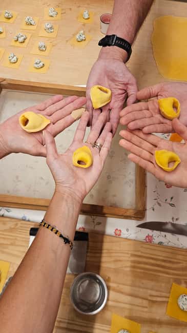 Bologna: Pasta Cooking Class, Ragu & Wine with Local Host - Sitting down to eat with local wine