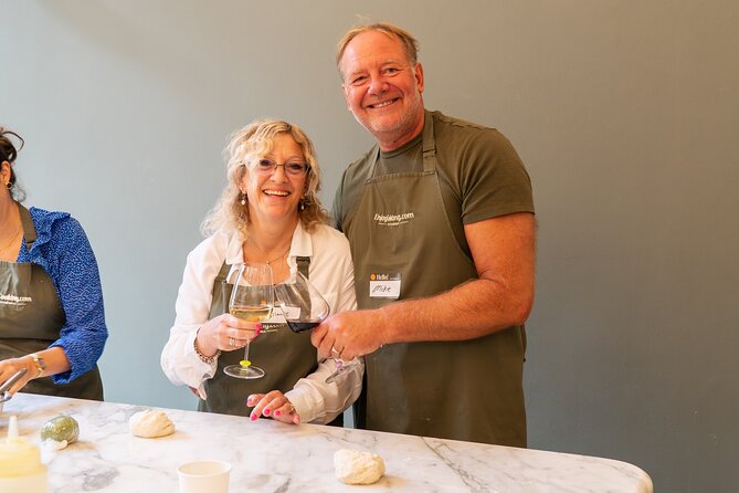 Cook & Dine in Rome: Pizza, Ravioli & Gelato with Unlimited Wine - Stretching Roman-style pizza dough