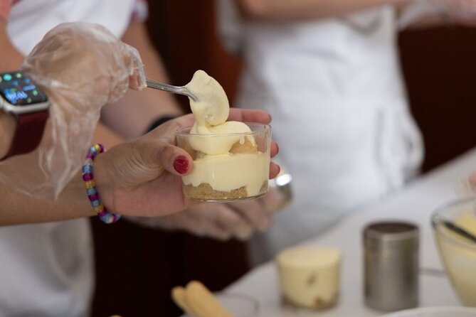 Fettuccine Ravioli and Tiramisu Cooking Class in Rome - Sitting down for the meal
