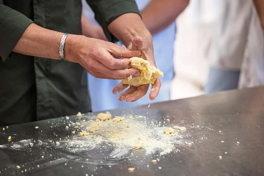 Florence: Handmade Pasta & Dessert Class with Unlimited Wine - Sitting down to eat your own work