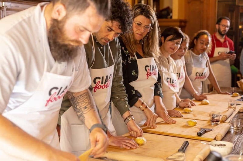 Florence: Pasta & Tiramisu Class with Unlimited Wine - Sitting down to eat your own lunch