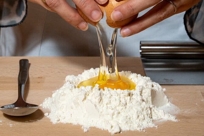 Florence: Tiramisu & Pasta Cooking Class with Unlimited Wine - Mixing pasta dough from scratch