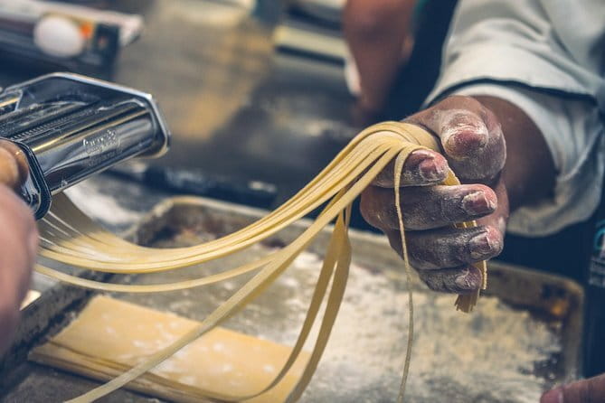 Hands-On Pasta Cooking Class in Florence with optional Pizza - Fettuccine, ravioli, and gnocchi at the shared table