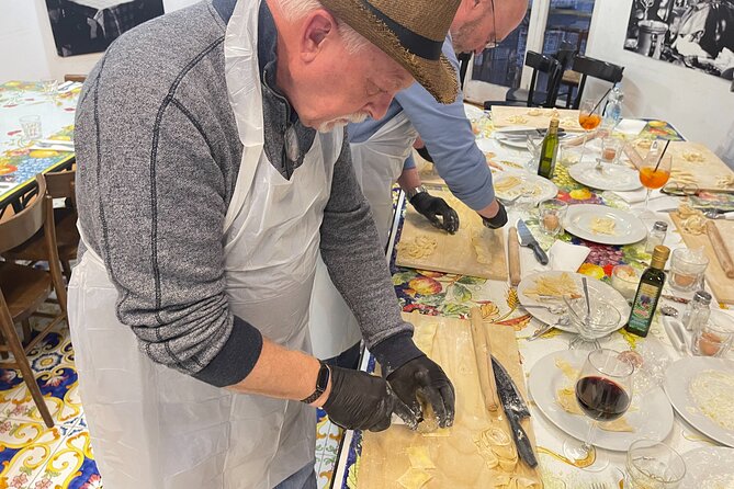 Hands-On Pasta Making and Traditional Tiramisu Workshop - Making egg pasta with hands and rolling pins