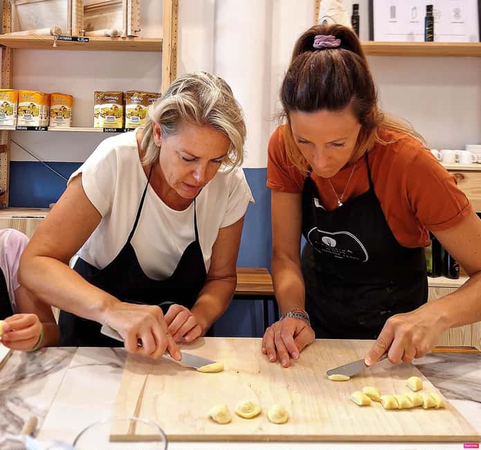 Lazise: Fresh Pasta and Tiramisù Cooking Class at Lake Garda - Sitting down to your own pasta with Bardolino