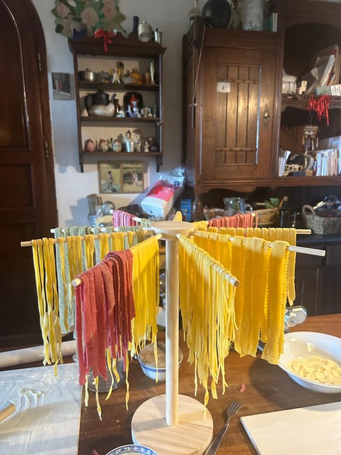 Lucca: Private Home-made Pasta Cooking Class - Sitting down to eat what you made