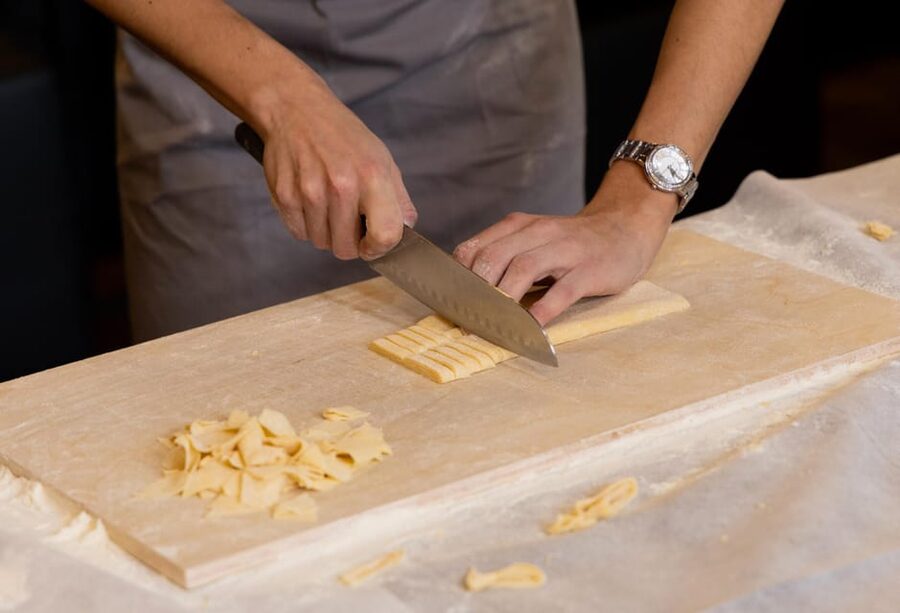 Masterclass: Aperol Spritz & Pasta Making Experience in Rome - Sitting down to eat what you made