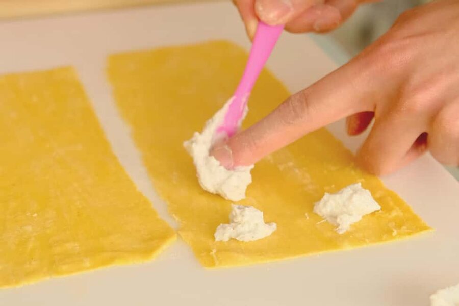 Milan: Fresh Pasta & Tiramisù Class in a Glamorous Home - Shaping ravioli and learning the filling