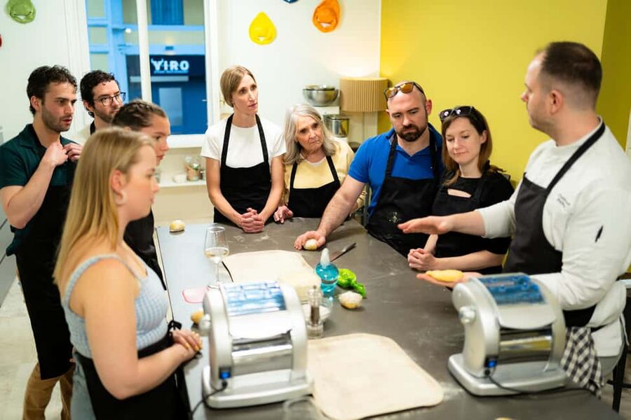 Milan: Pasta, Gnocchi and Tiramisù Cooking Class with Wine - Sitting down to eat what you made