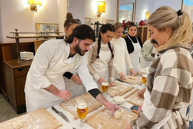 Pasta Cooking Class with Pesto Sauce Making in Rome City Center - Sitting down to eat what you made