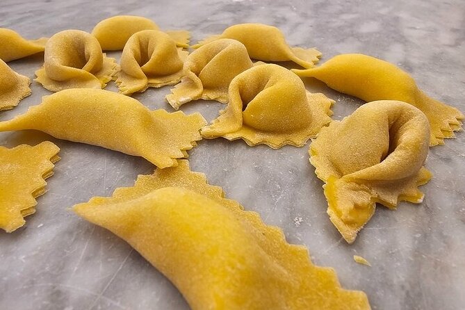 Pasta Fettuccine, Ravioli and Tiramisu Cooking Class in Florence - Sitting down to eat the meal you made