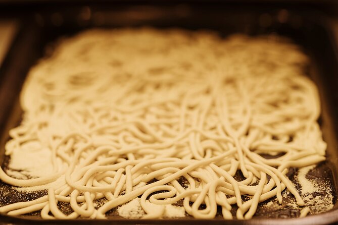 Pasta Making and Tiramisù Class in Rome (SHARED) - Rolling fresh pasta by hand