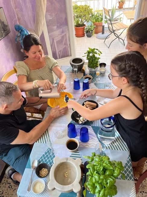 Riomaggiore: Pasta and Tiramisù Cooking Class - Grinding Ligurian pesto by hand