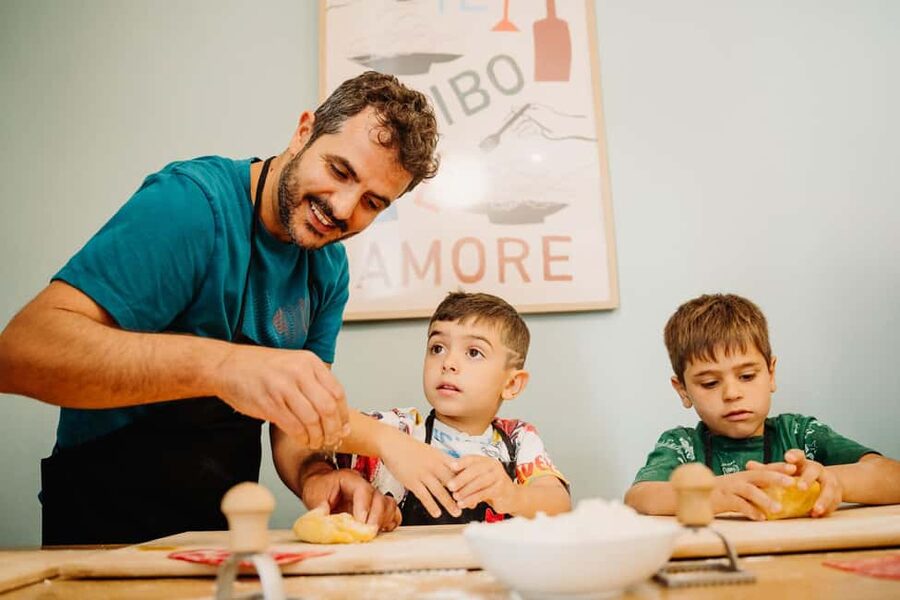 Rome: Fresh Pasta-Making Class with Wine and Gelato - Sitting down to eat what you made