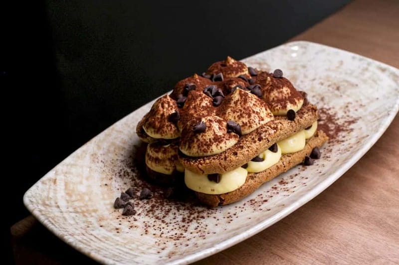 Rome: Hands-On Pasta & Tiramisu Class with Unlimited Wine - Sitting down to eat with Italian wine