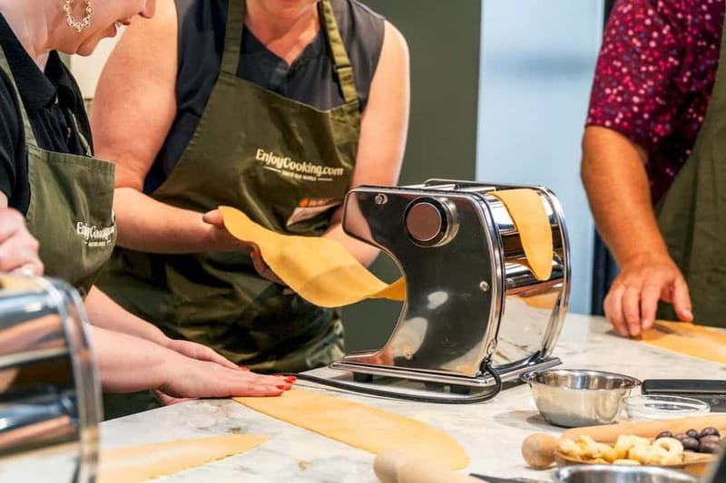 Rome: Hands-On Pasta & Tiramisu Class with Unlimited Wine - Entering the kitchen and meeting your chef