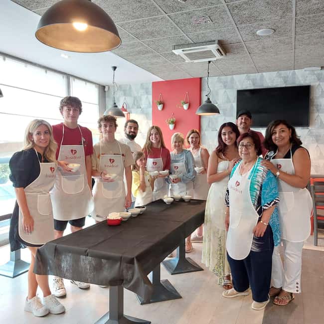 Rome: Pasta and Gelato Cooking Class with Wine or Beer - Making fettuccine with egg, flour, and elbow grease