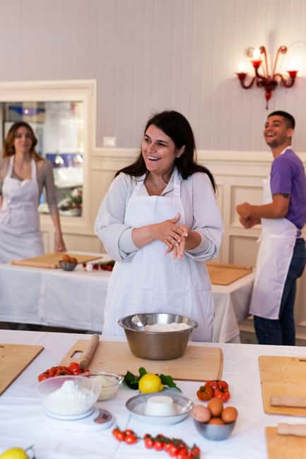 Rome: pasta and tiramisu cooking class in the city center - Sitting down to eat what you made
