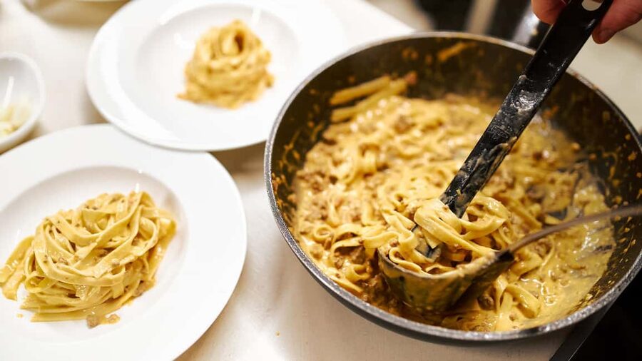 Rome: Pasta and Tiramisu Cooking Class with Prosecco - Rolling fresh fettuccine by hand