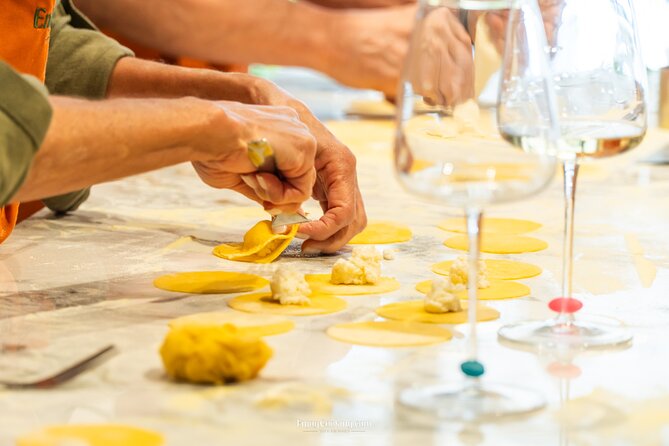 Rome Pasta and Tiramisu Making Experience with Premium Wine - Cooking pasta in Piazza Mattei