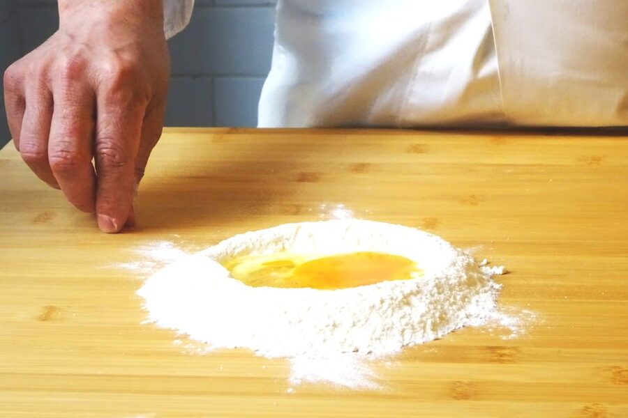 Rome: Pasta Cooking Class in a Professional Pasta Laboratory - From worktable to shared supper