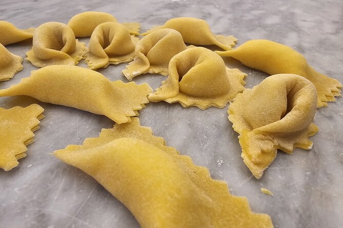 Rome: Pasta Fettuccine Ravioli and Tiramisu Cooking Class - Sitting down to eat what you made