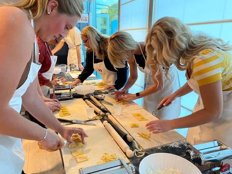 Rome: Pasta, Ravioli & Tiramisu Class with Unlimited Wine - Rolling dough into fettuccine