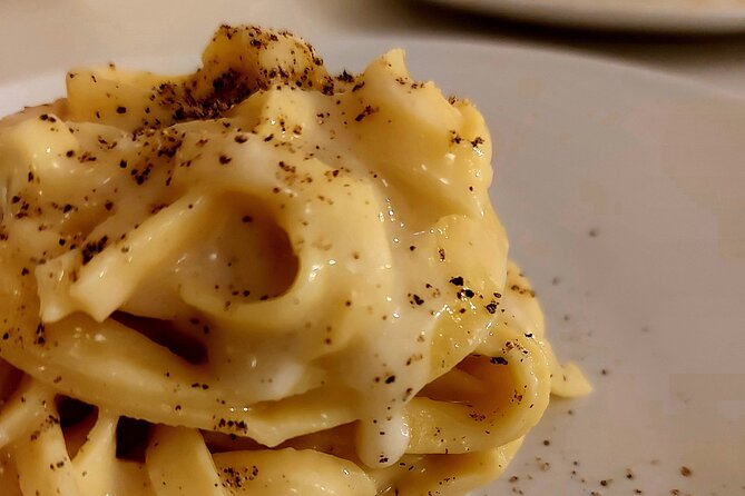 Small-Group Pasta Making steps from the Vatican Museums - Rolling fettuccine and tasting Amatriciana